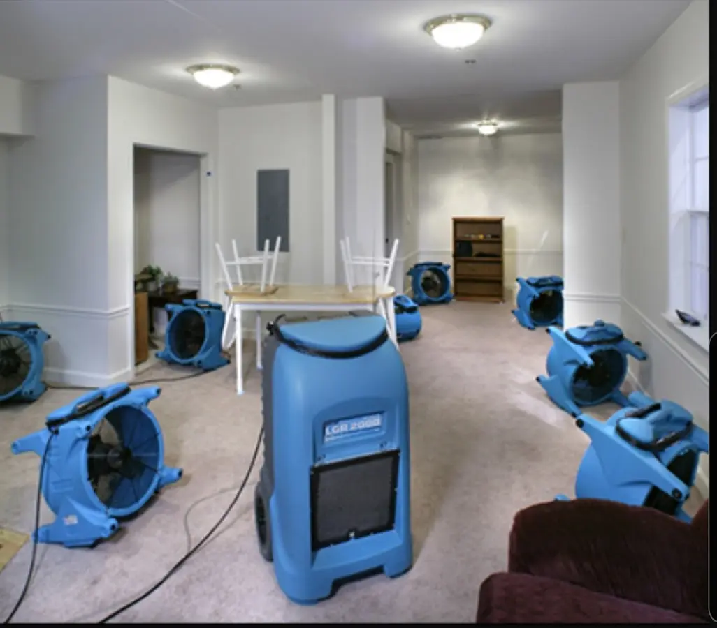 Air movers and dehumidifier setup for Water Damage Restoration in Strawberry